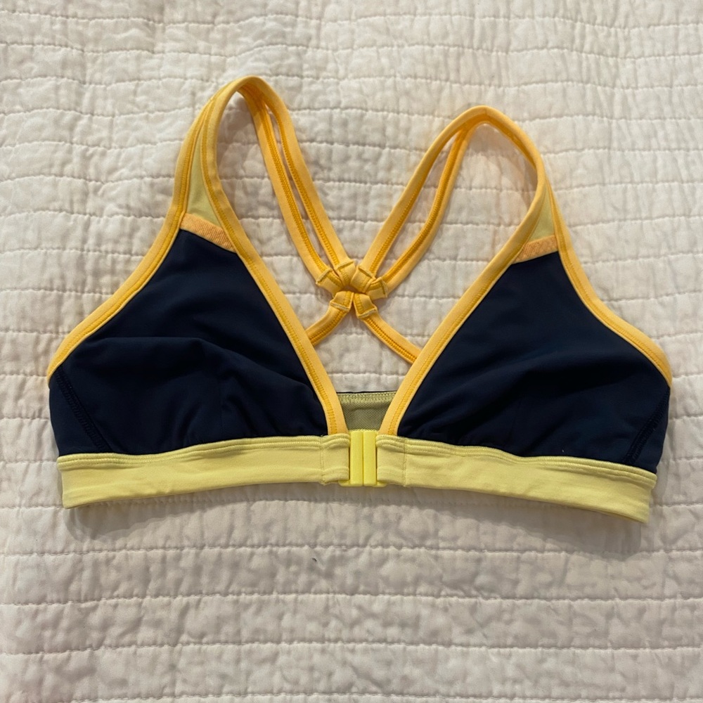 Lululemon bathing suit top. Front clasp. Size 6. Navy/yellow. No damages.